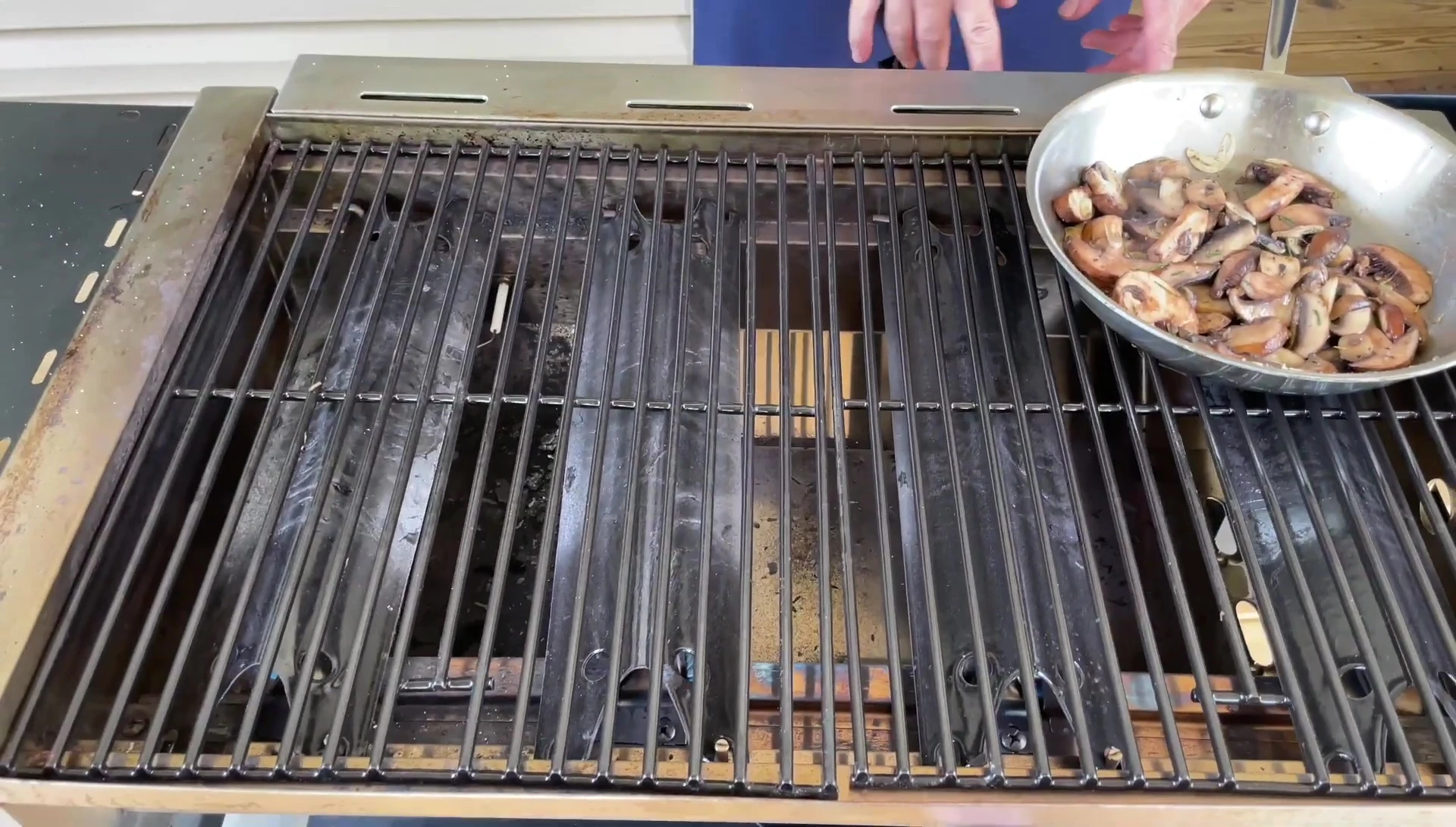 Steaks being placed on the hot flat top grill