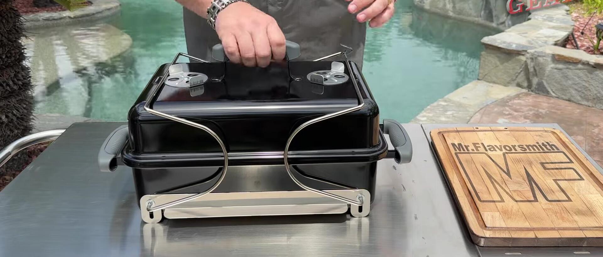 Close-up view of the grill's handles and legs