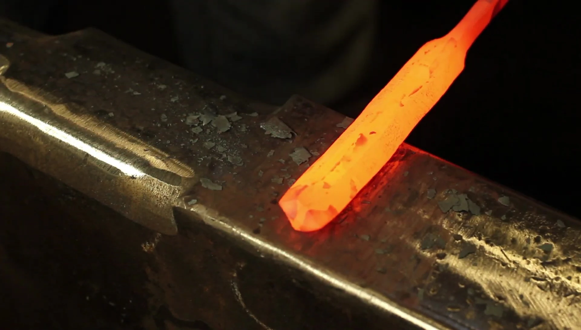 The smith begins working on the spatula head from the center.