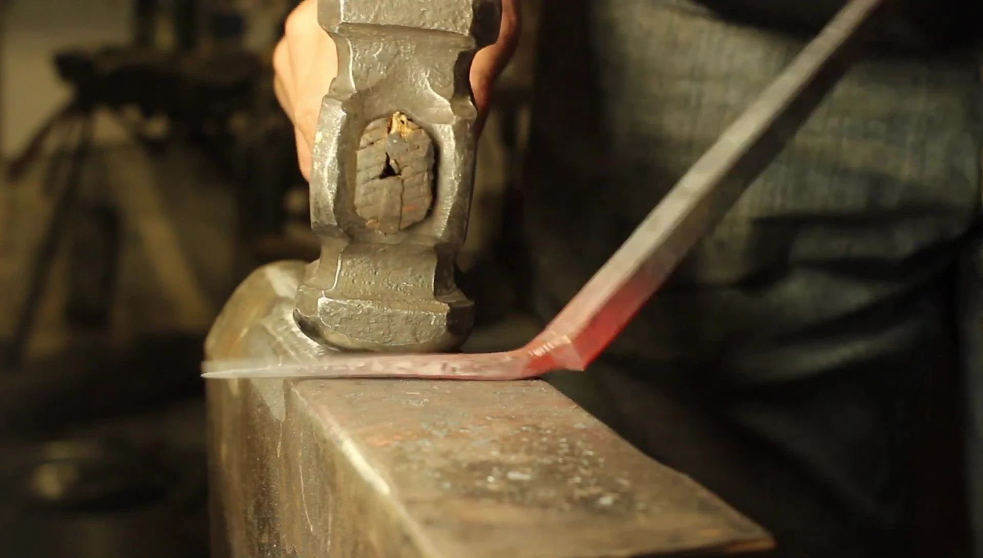 The smith forges a hanging eye for the spatula handle.