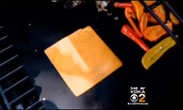 Placing the cheese onto the grill mat