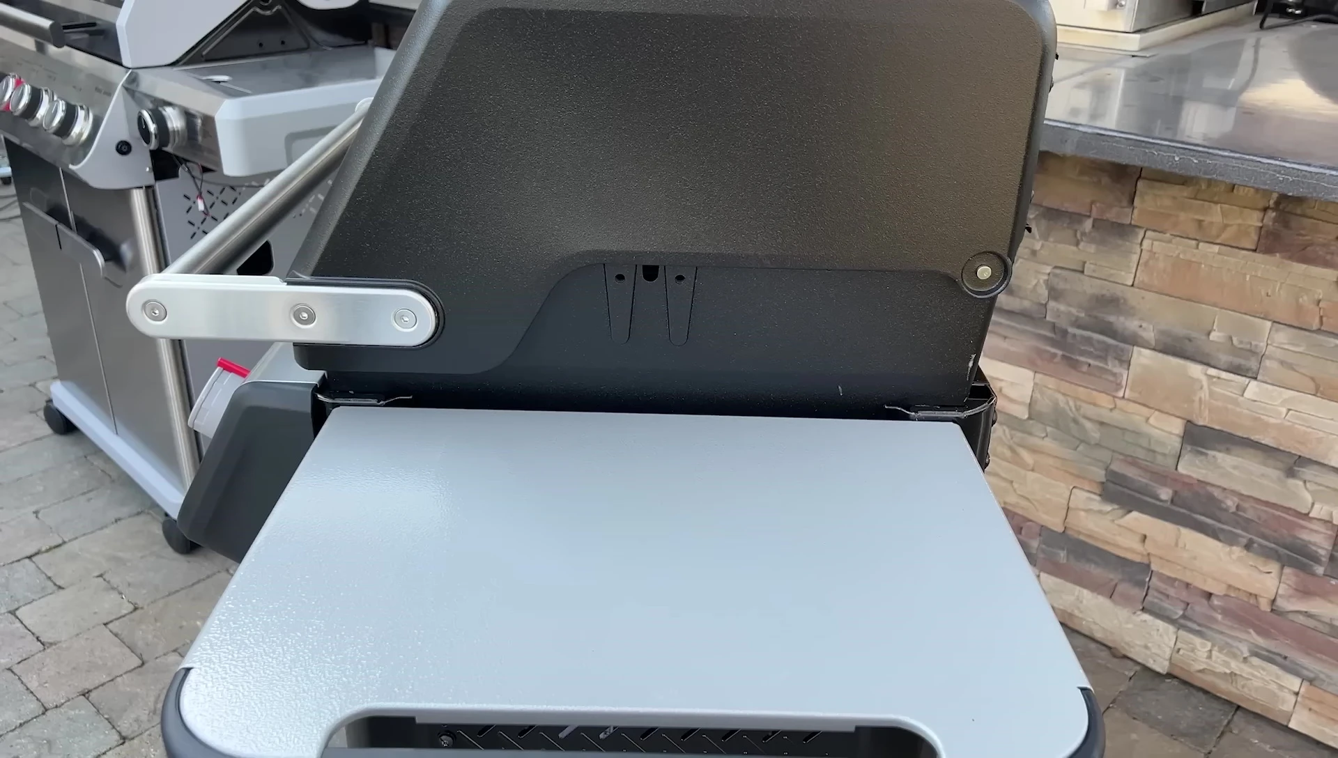 Close-up of the side shelves on one of the grills.