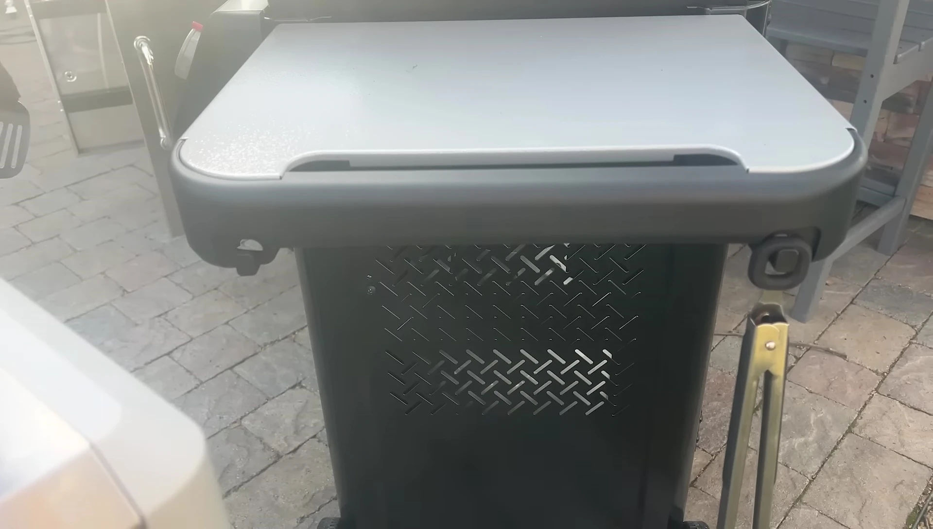 Overview of the storage space and tool hooks on each grill.