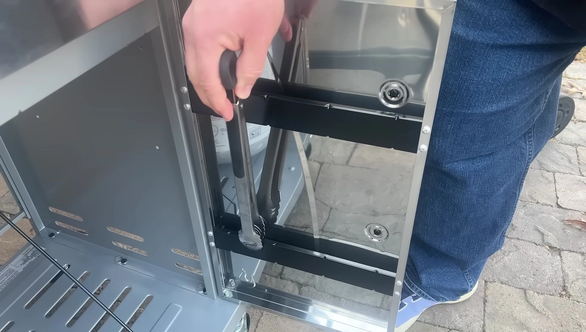 Close-up of the Char-Broil's tool storage.