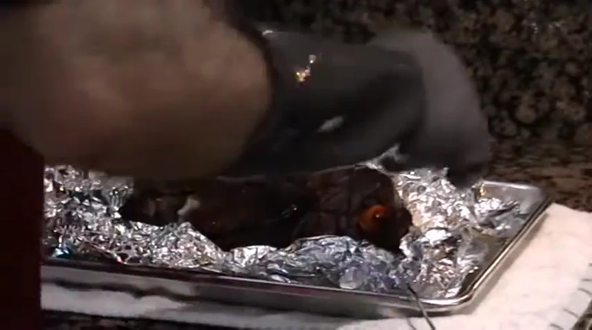 Pulling the pork apart.