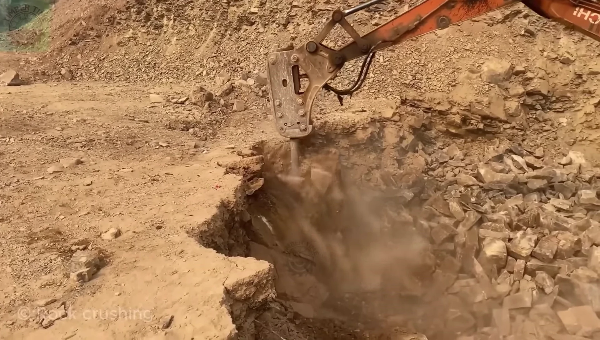 Bulldozers and breakers crushing stone.