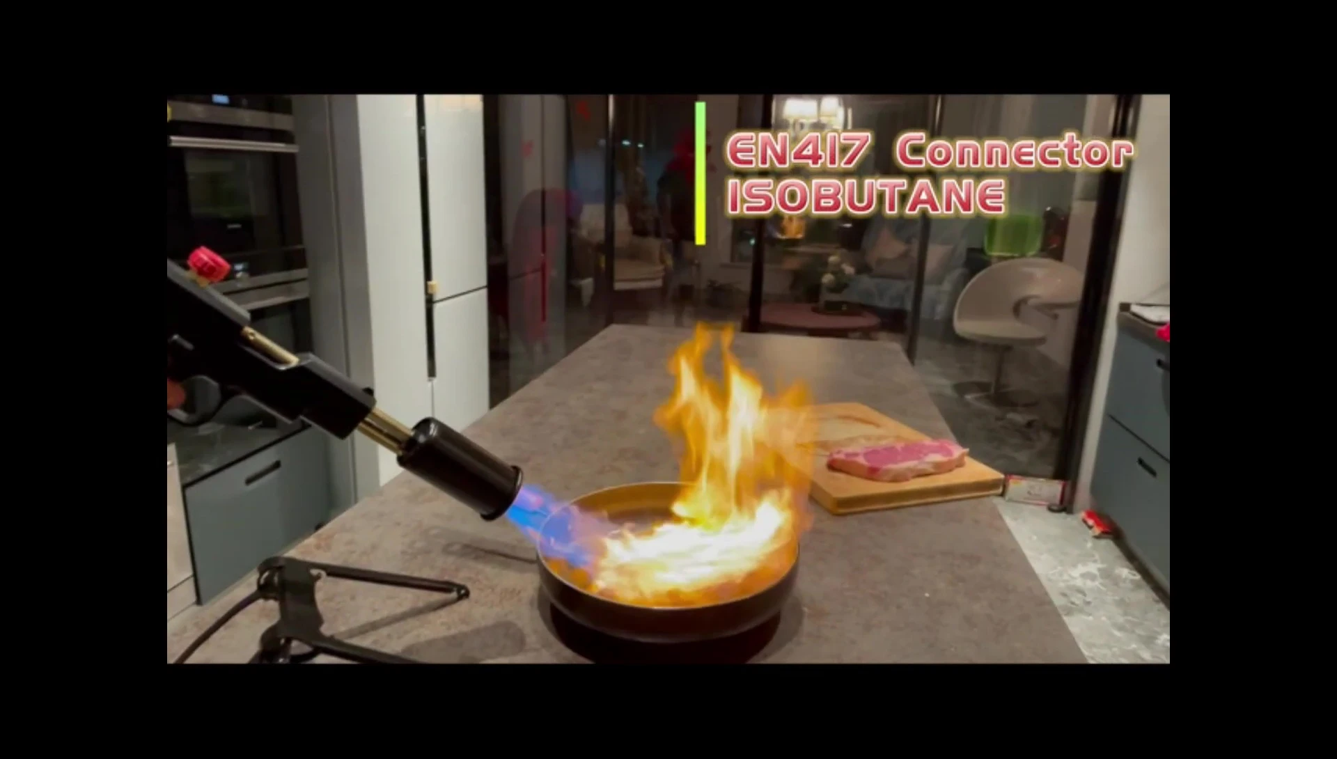 Demonstrating the adjustable flame size control on the cooking torch.