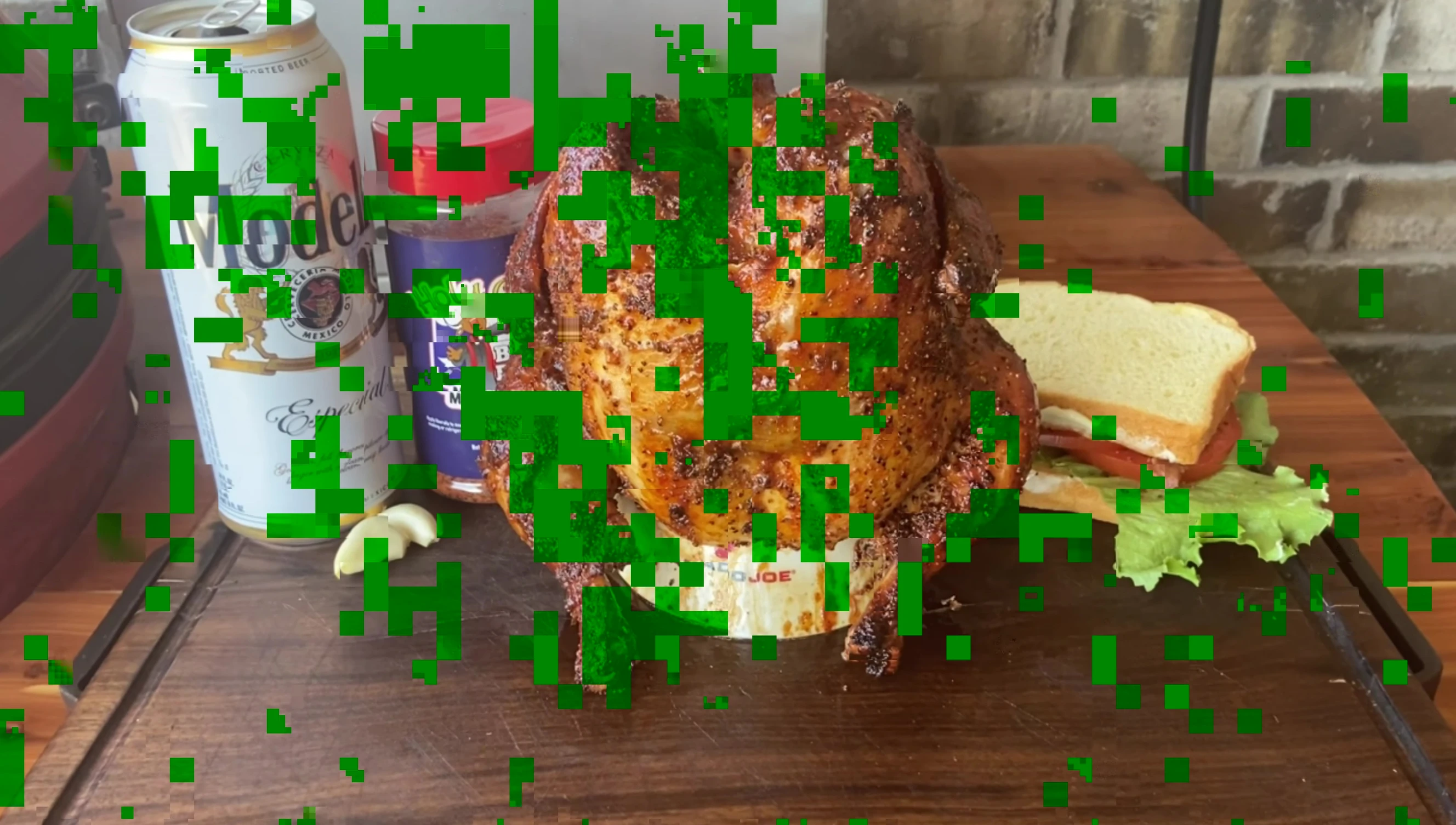 Beer can chicken being cooked