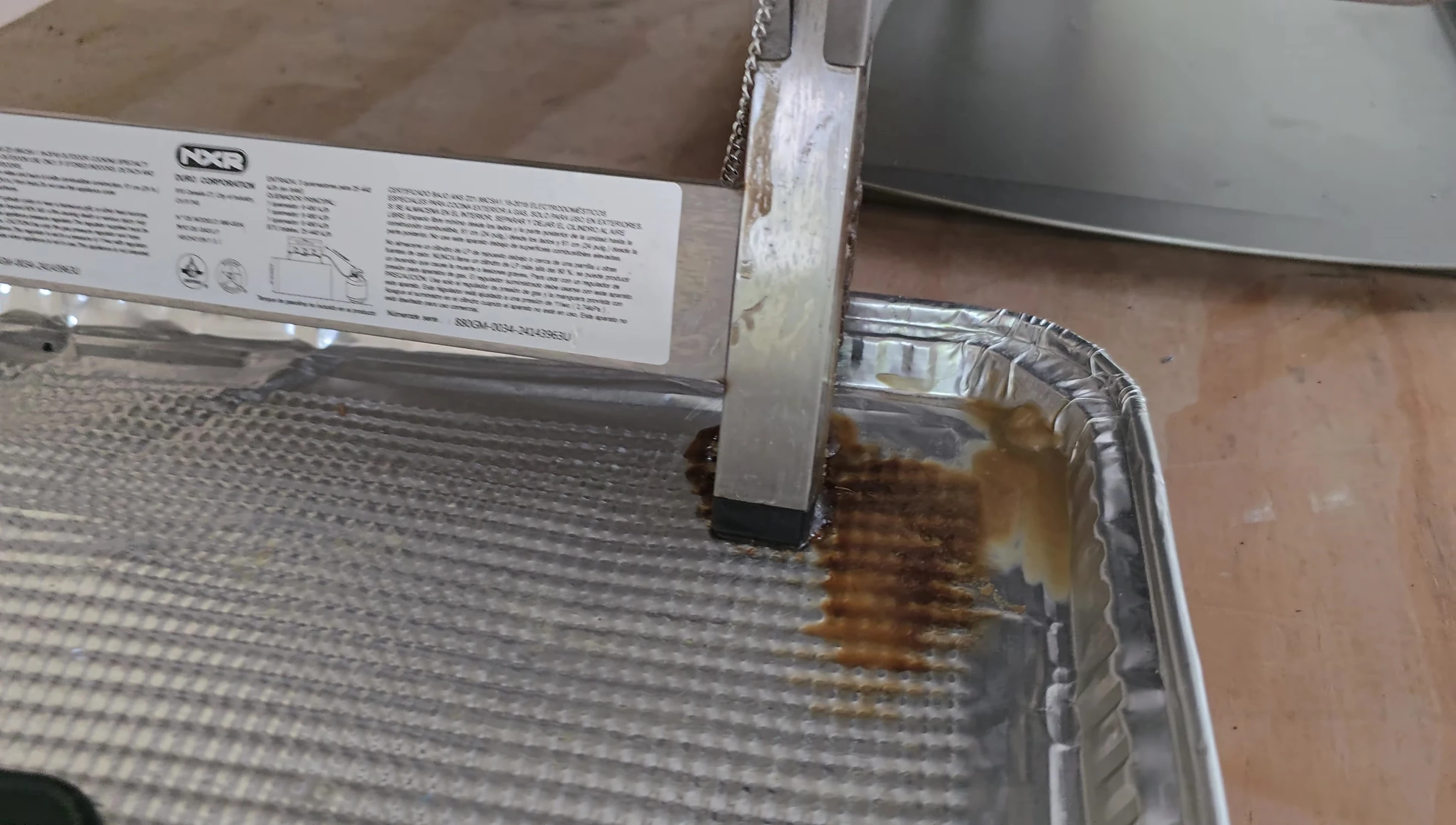 Grease dripping onto the ground.