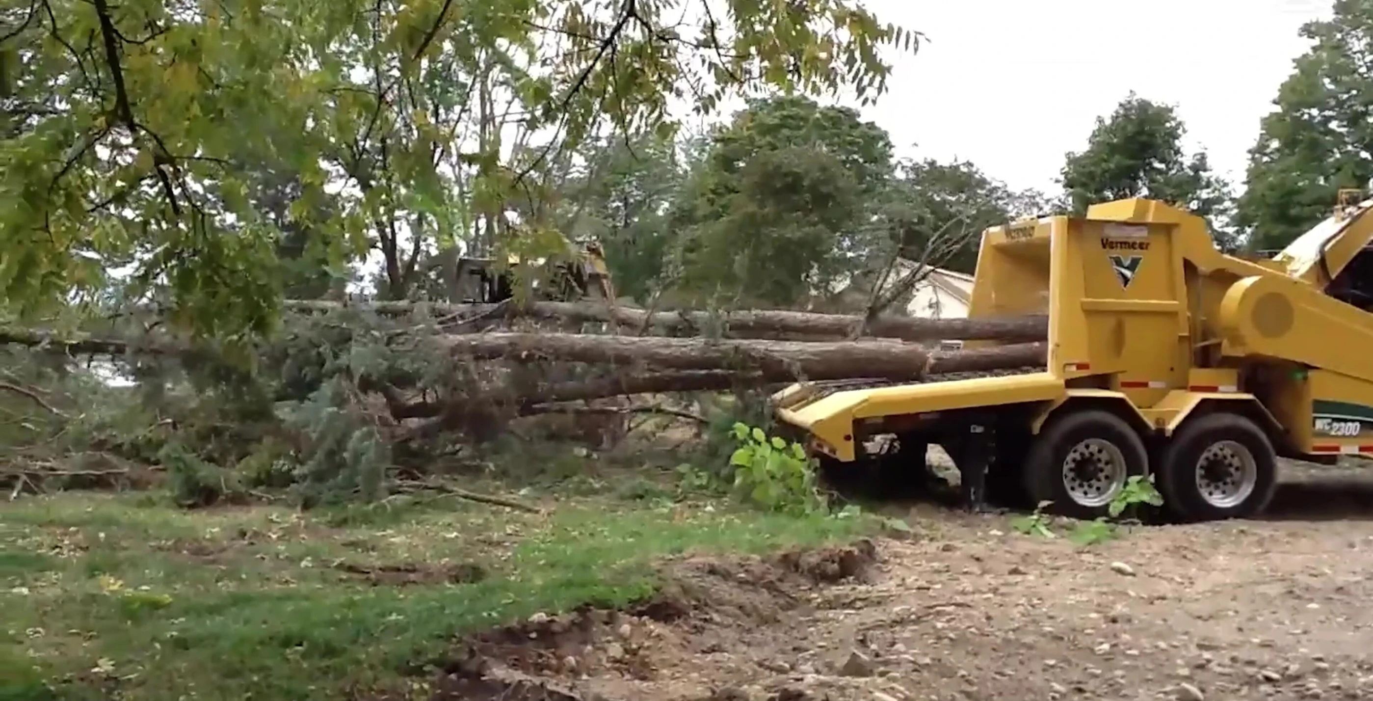 Vermeer WC2300 XL wood chipper clearing storm debris
