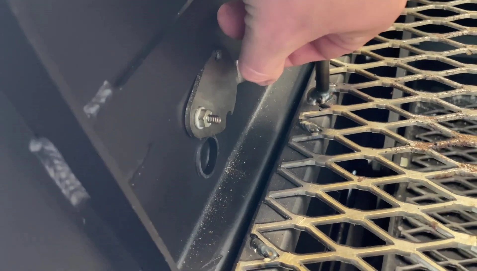 Close-up of the temperature probe port on the grill.
