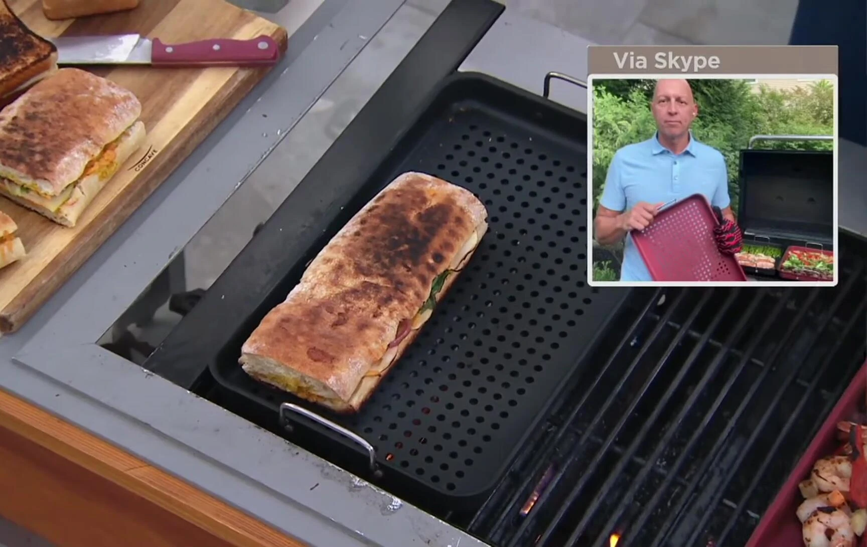 Grill Topper demonstrating its vertical handles.