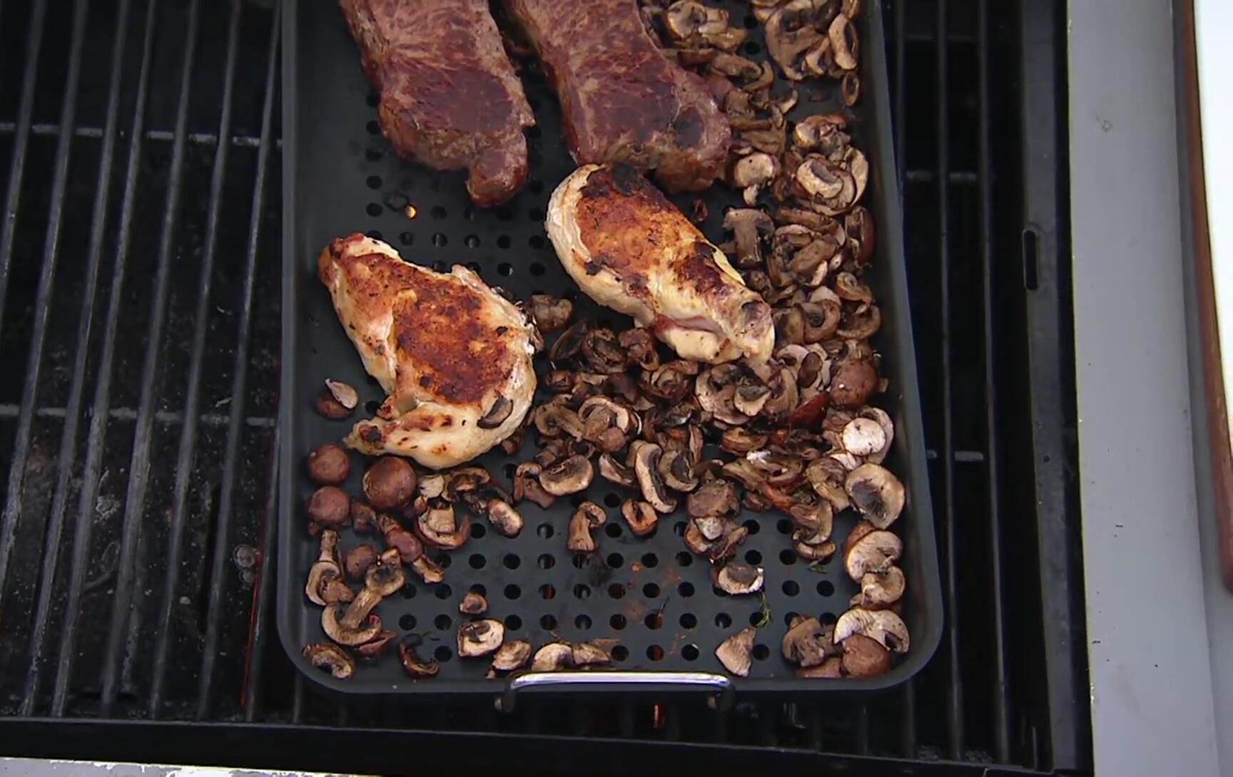 Close-up of the Grillville Grill Topper in black and red.