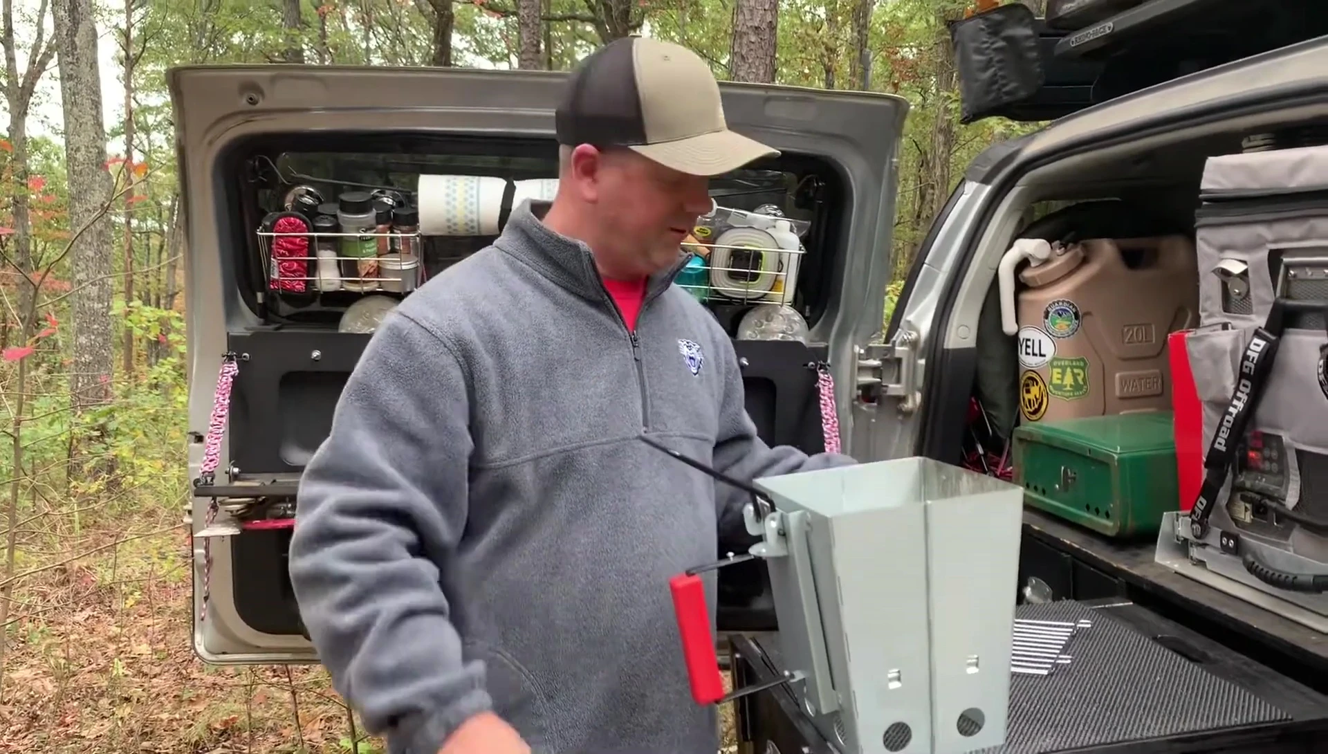 The reviewer showing how to use the grill for cooking