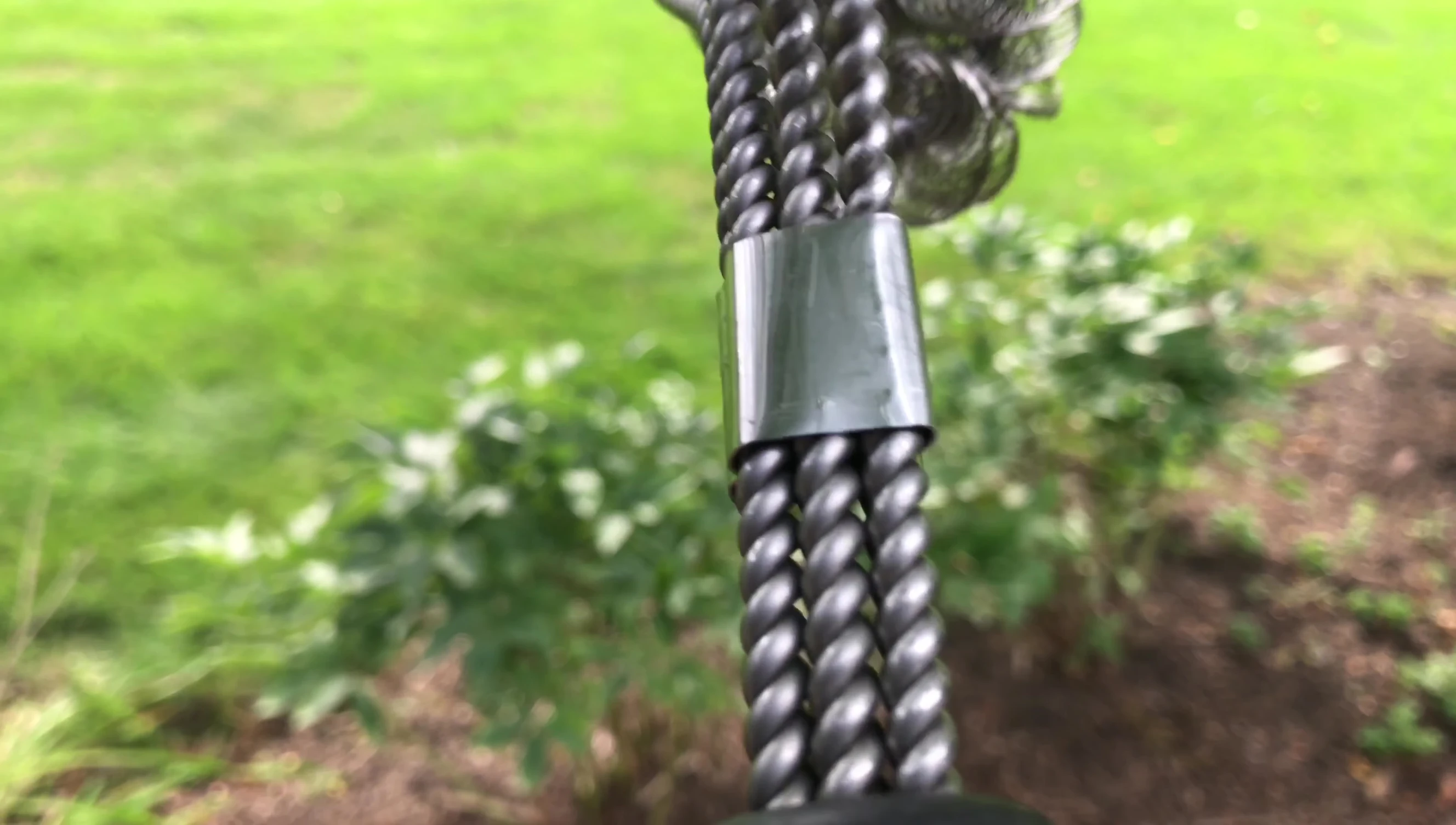 Detailed view of the twisted wire bristles of the grill brush.