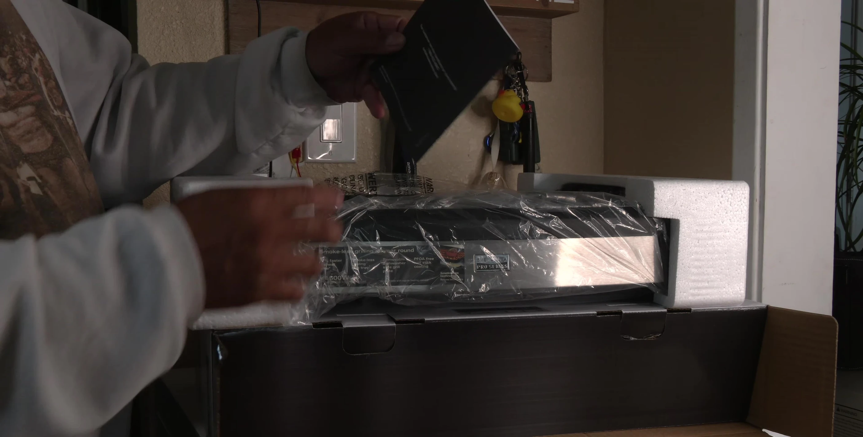 The manual and temperature chart included with the grill.