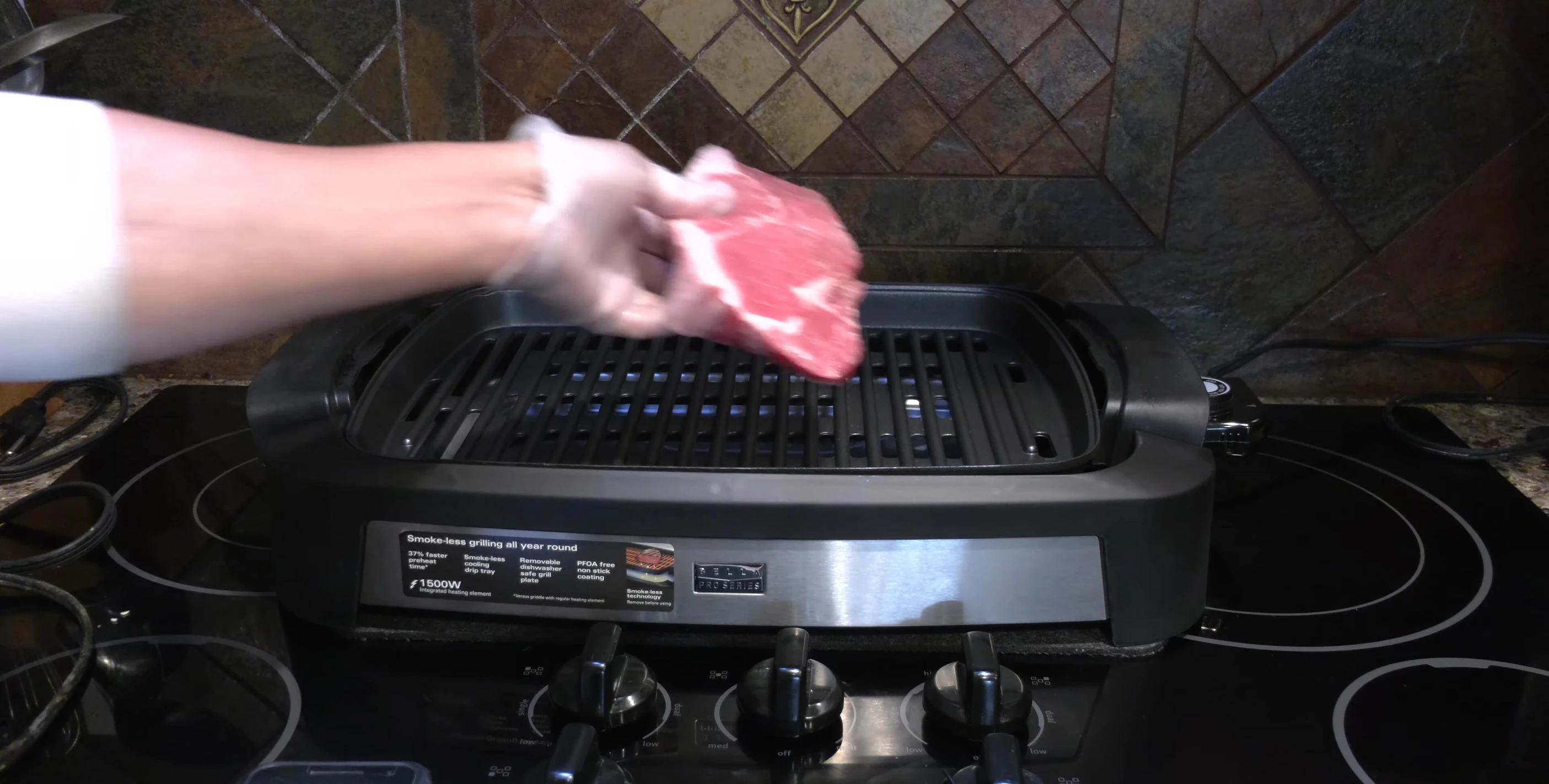 Placing the steaks on the grill.
