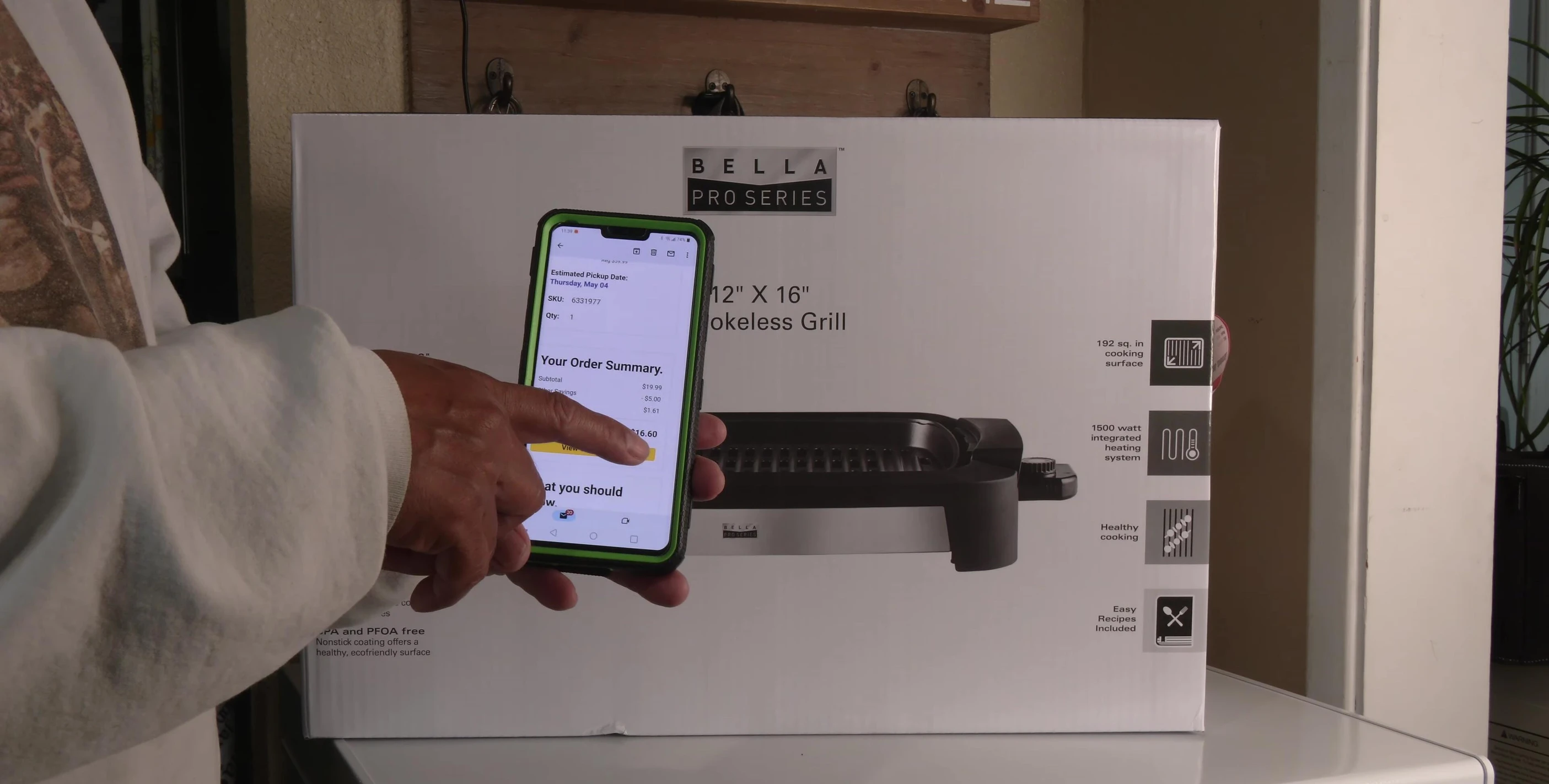 Close-up of the Bella Pro Series Grill box showing the price and final cost.