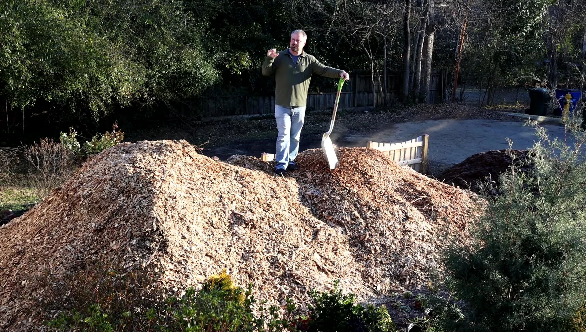 Speaker emphasizing the soil-enhancing properties of wood chips