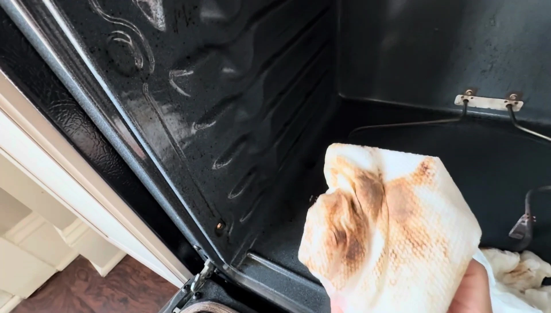Significant amount of grime removed from the left oven wall.