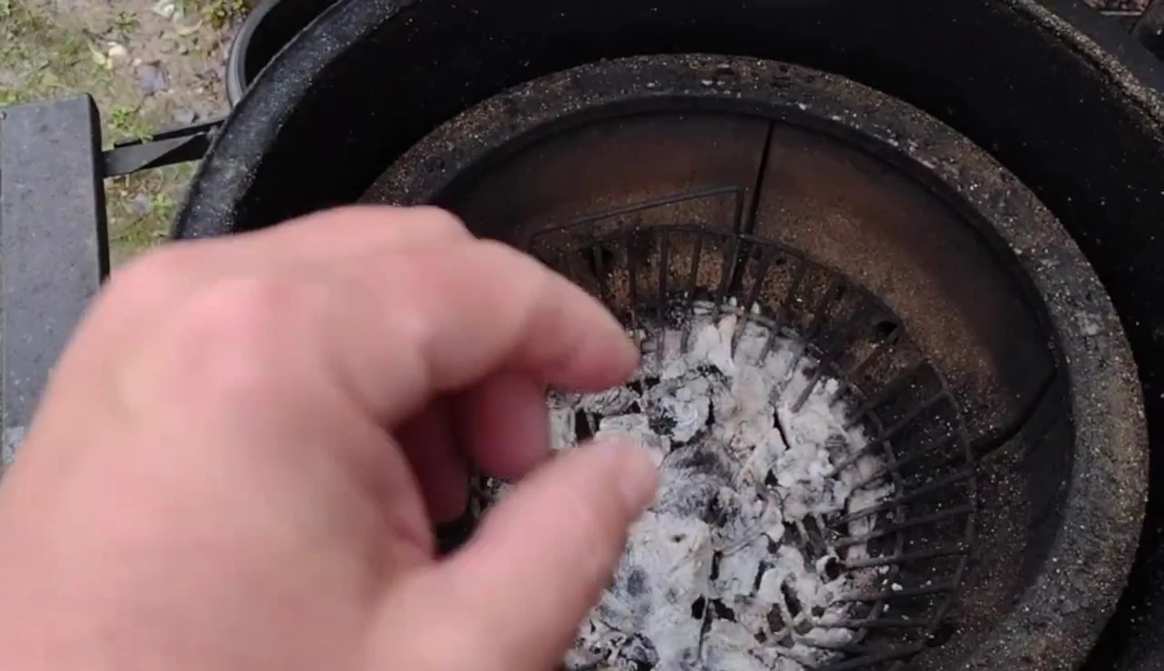 Image showing the previous ash plate with holes, highlighting the airflow restriction problem.
