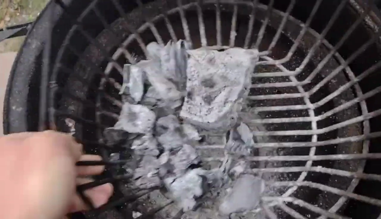 Demonstration of shaking the ash out of the basket.