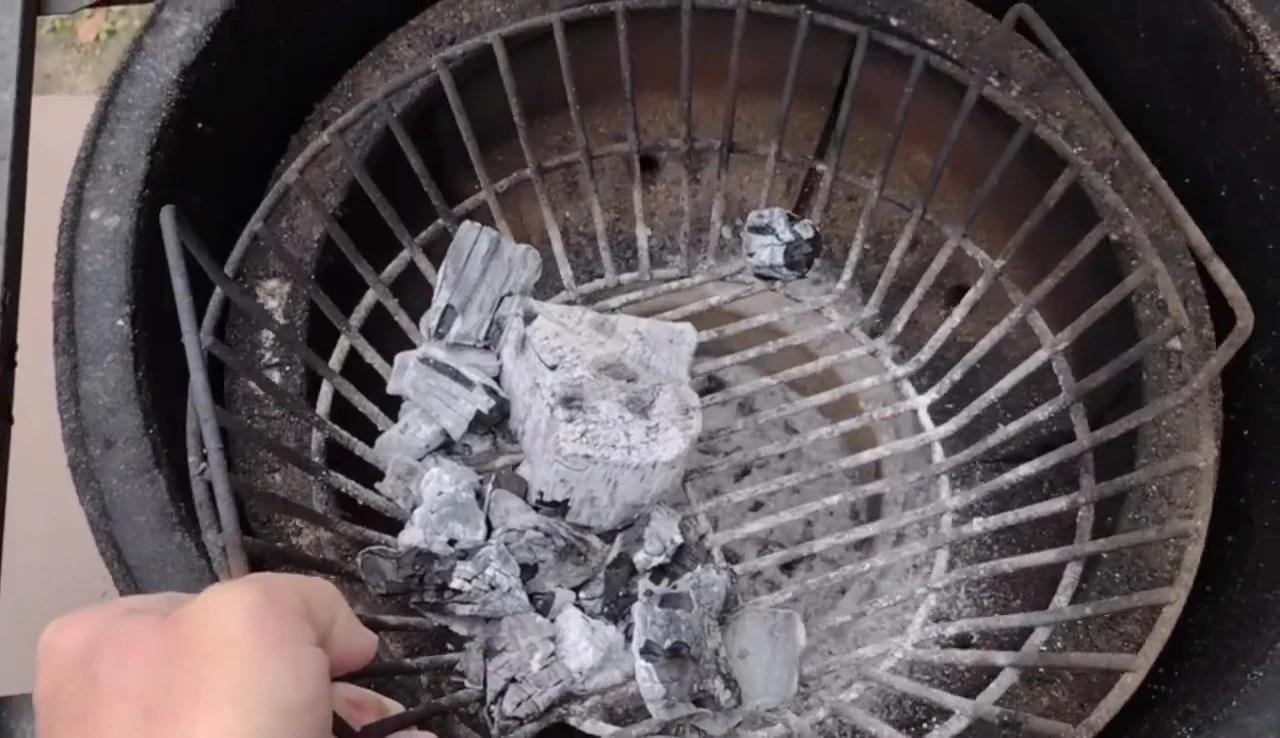 The ash basket during a long cook, showcasing its ample capacity.