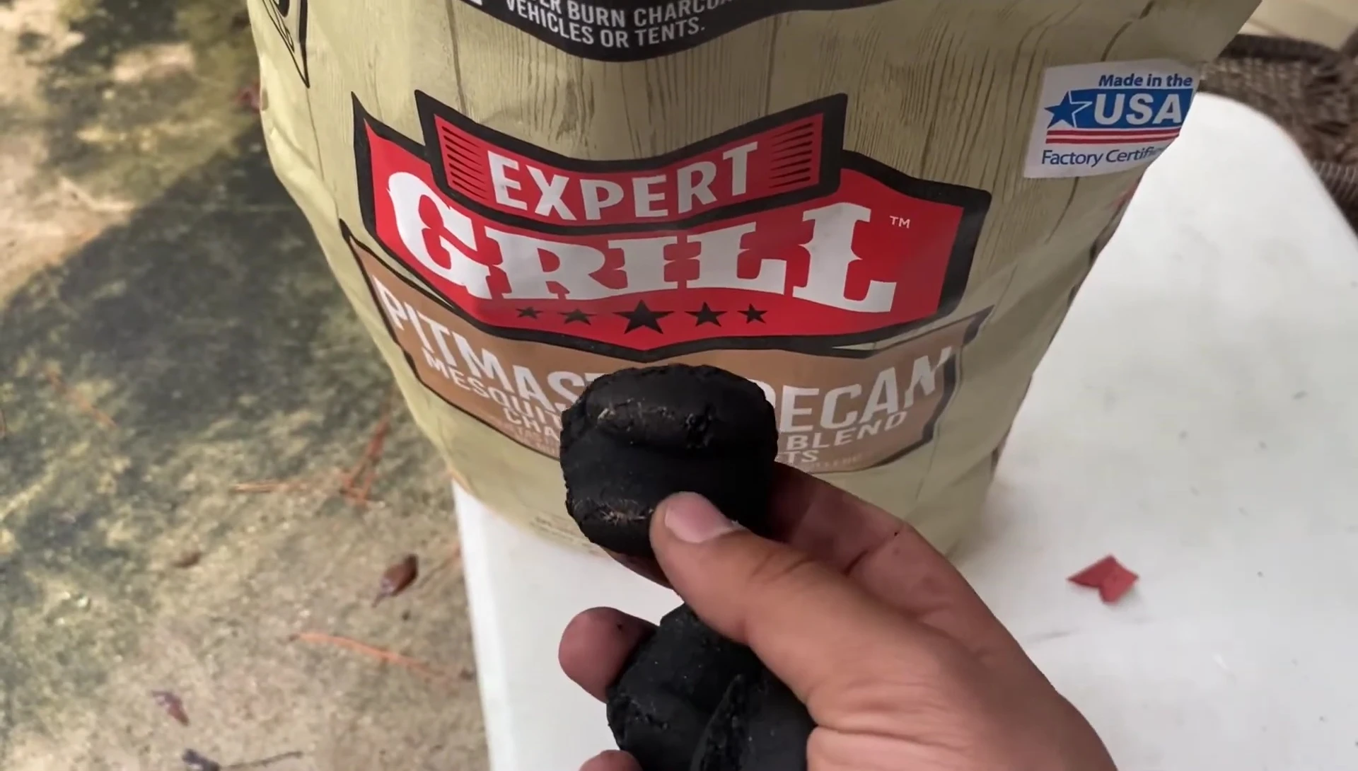 The reviewer setting aside a piece of charcoal for a burning test