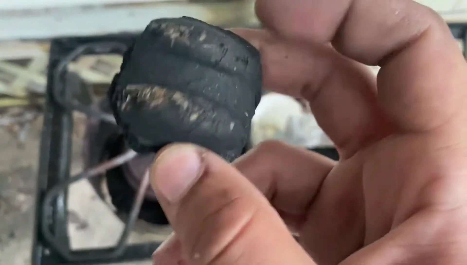 View of the charcoal showing visible sawdust or wood shavings