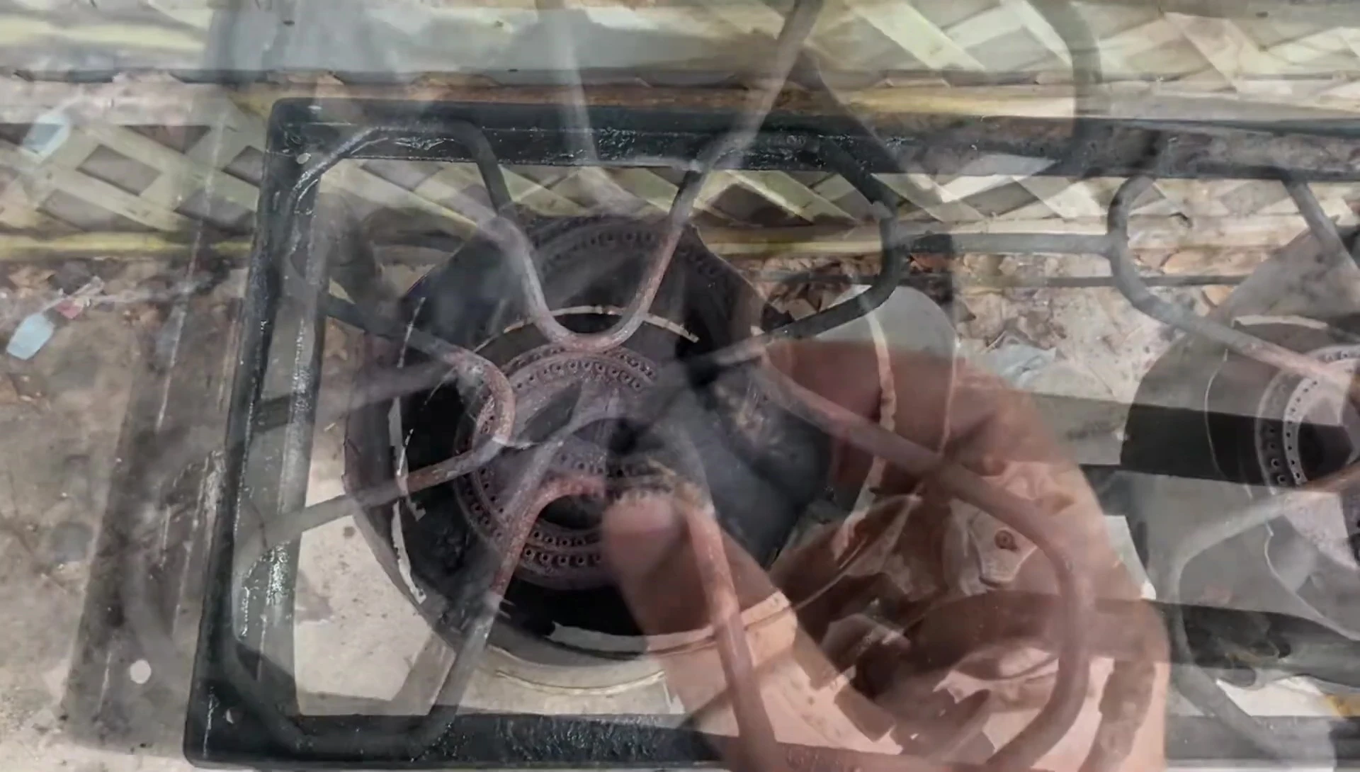 The charcoal burning, emitting smoke