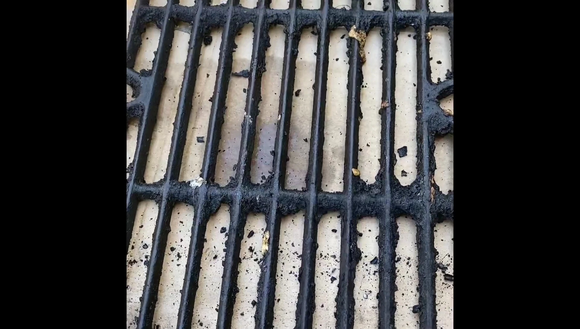 Before cleaning: The extremely dirty grill grates showing significant buildup.