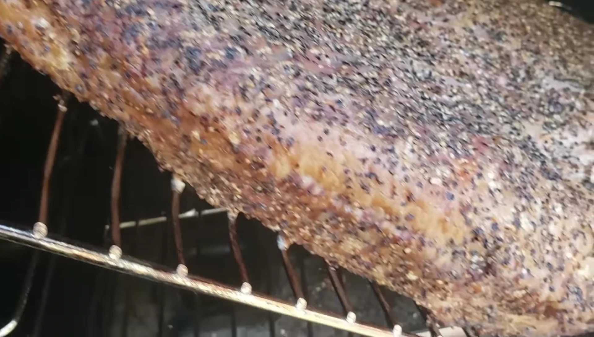 Opening the smoker to release excess steam.