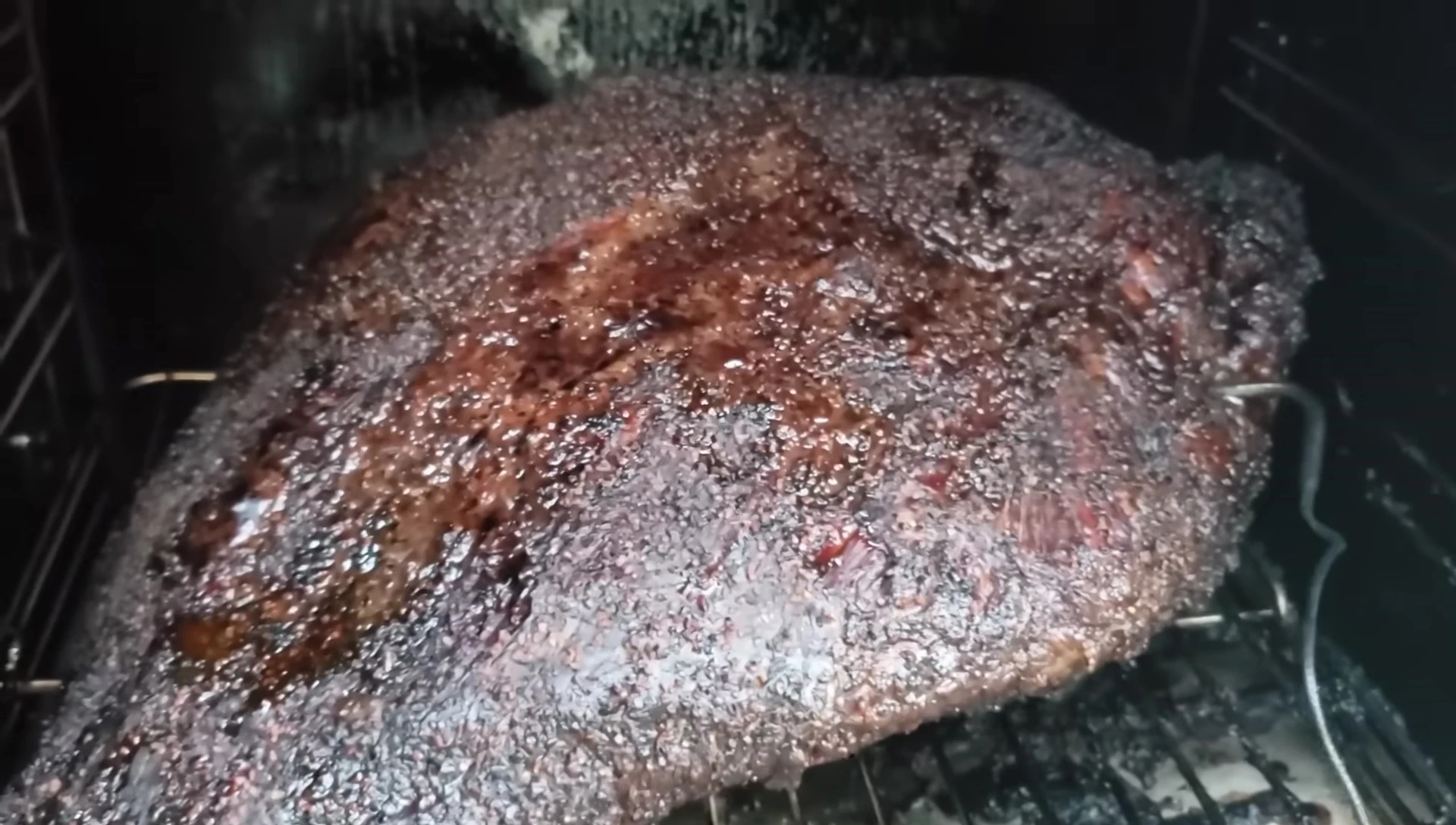 Wrapping the brisket in foil.