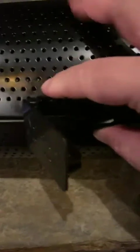 Close-up shot showing the button mechanism for securing the tumbler.