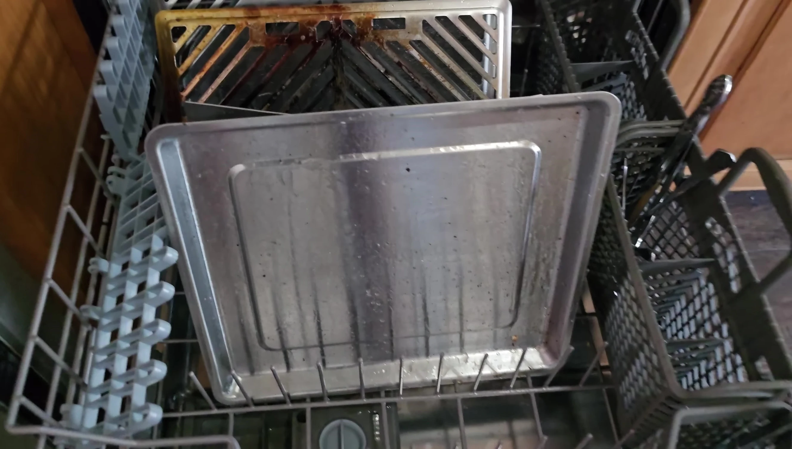 Close-up view of the stainless steel components of the grill, highlighting its durable construction.