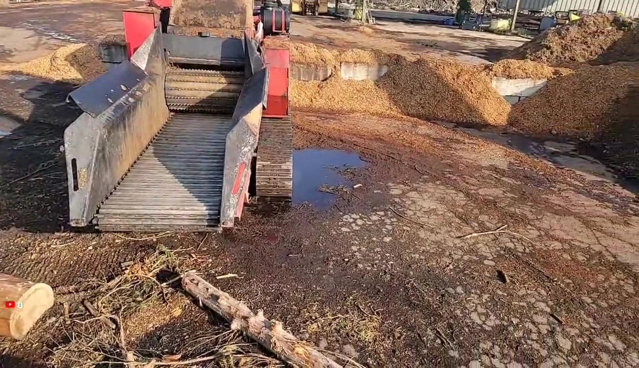 Close-up shot of Betsy, the wood chipper, being prepared for operation.