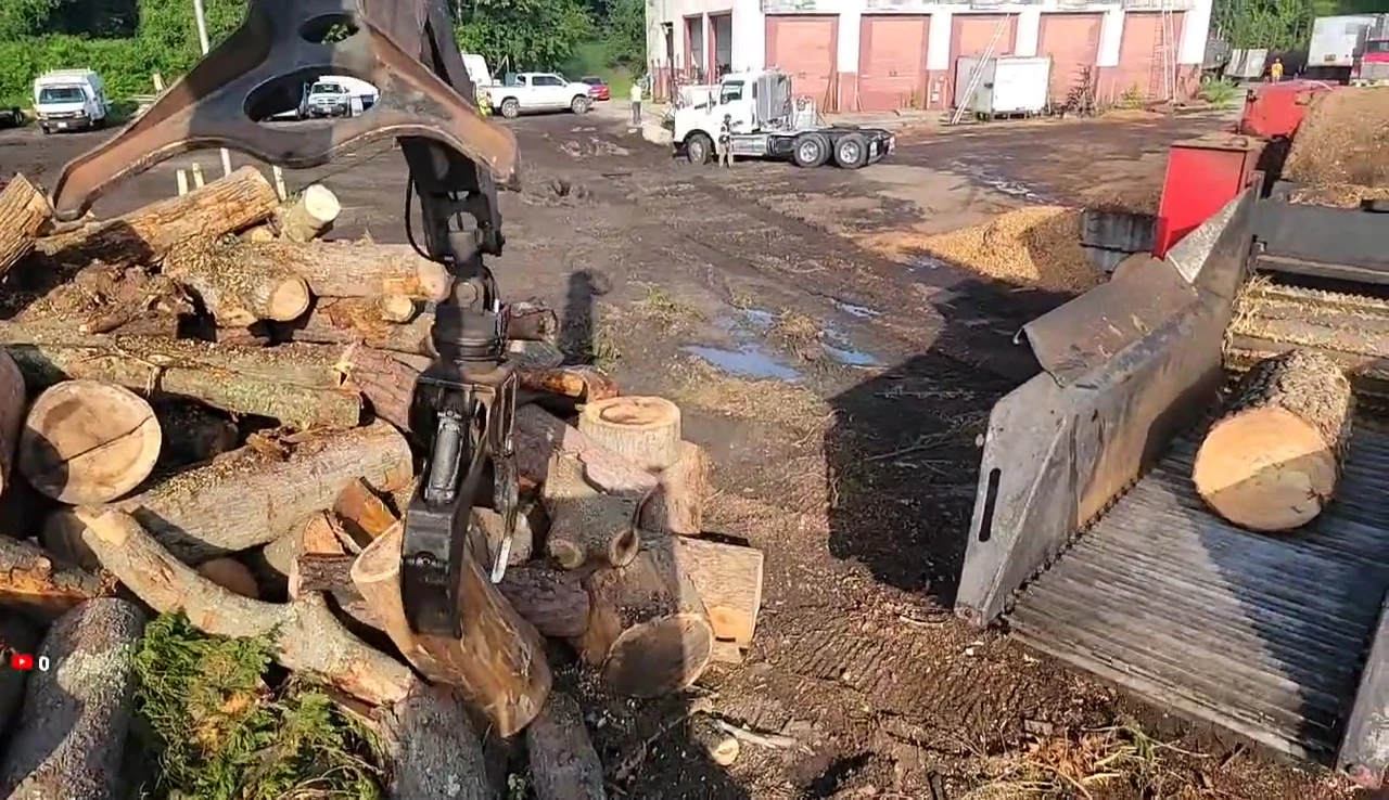 The logger working on his wood chipping job.