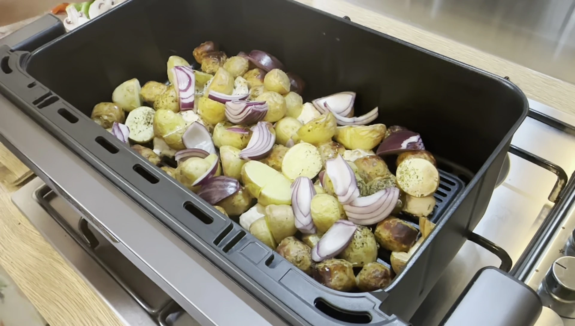 The cooked meal in the air fryer basket.