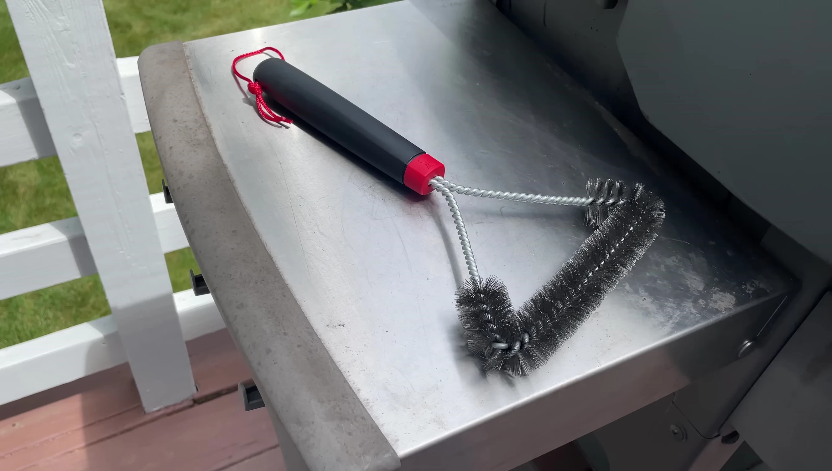 Close-up of the Weber three-sided grill brush