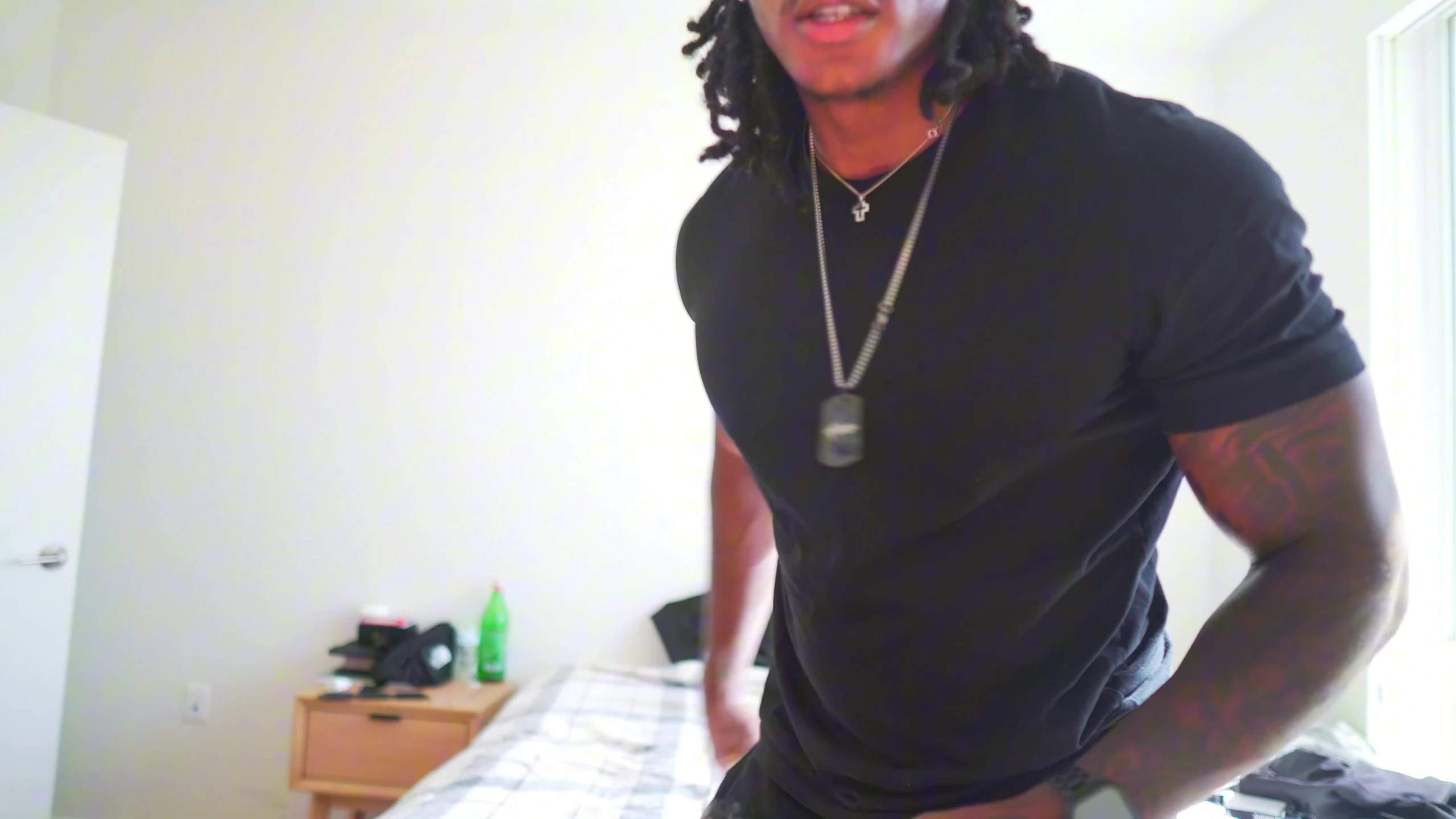 The YouTuber trying on the grillz.