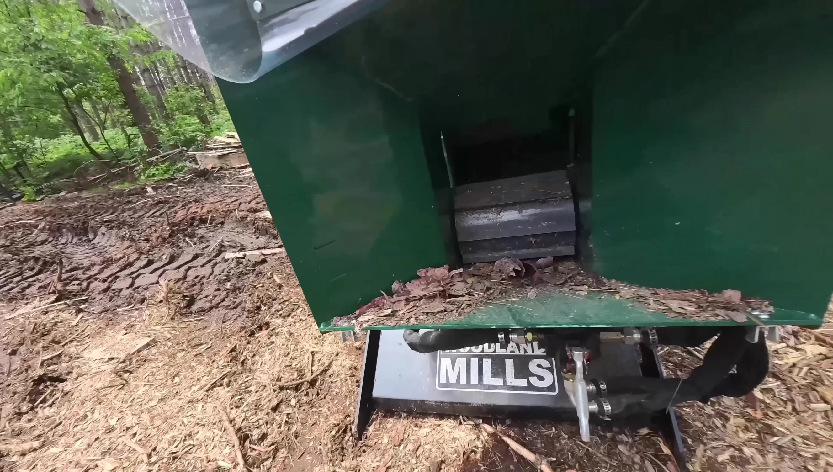 Close-up shot of the large infeed opening and hydraulic roller.