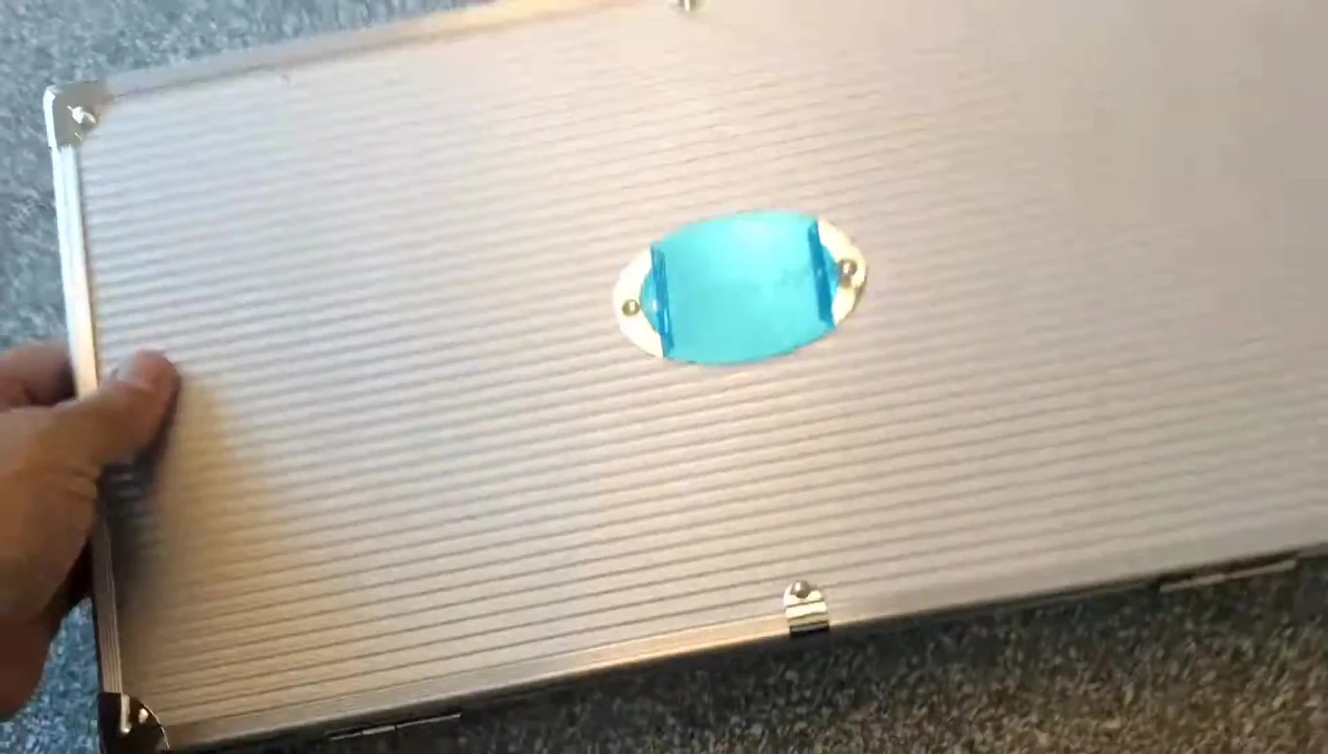 Close-up of the Monbix logo on the grill set case.