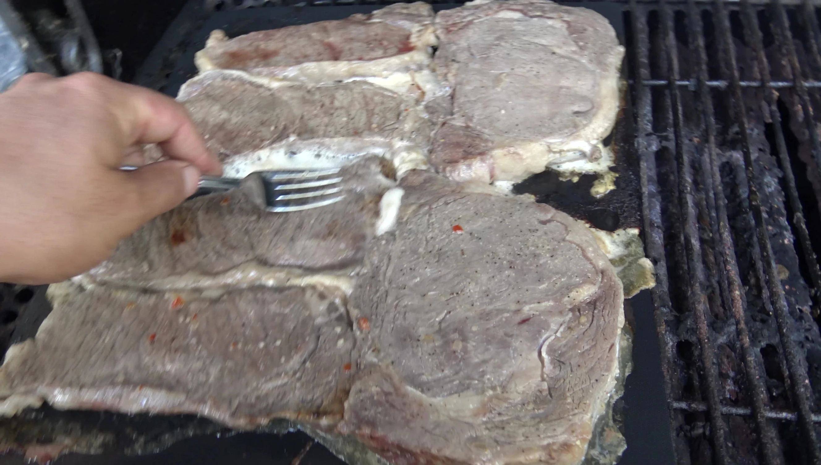 Cooked steaks on the mat.