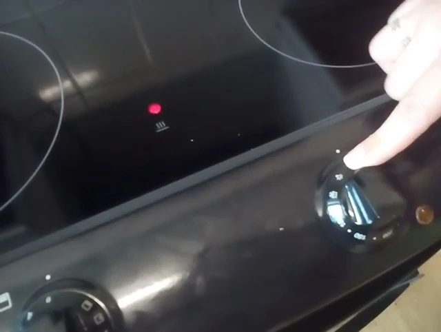The oven light control symbol.