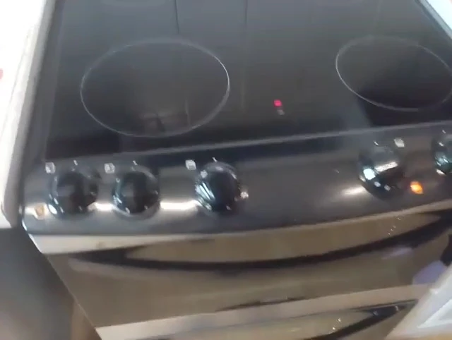 The red indicator light showing residual heat.