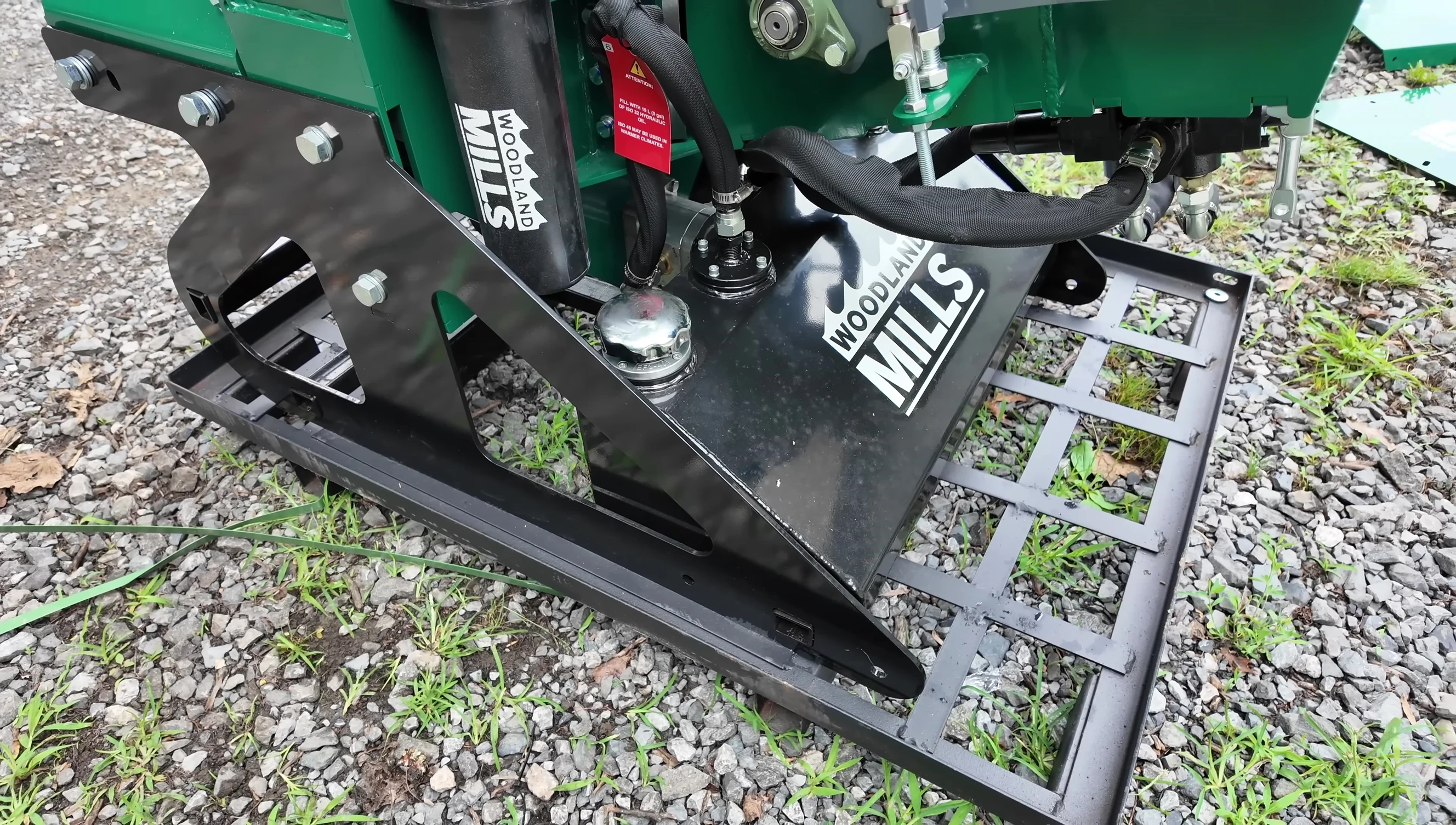 Close-up of the gas shocks replacing the springs on the take-up wheel.