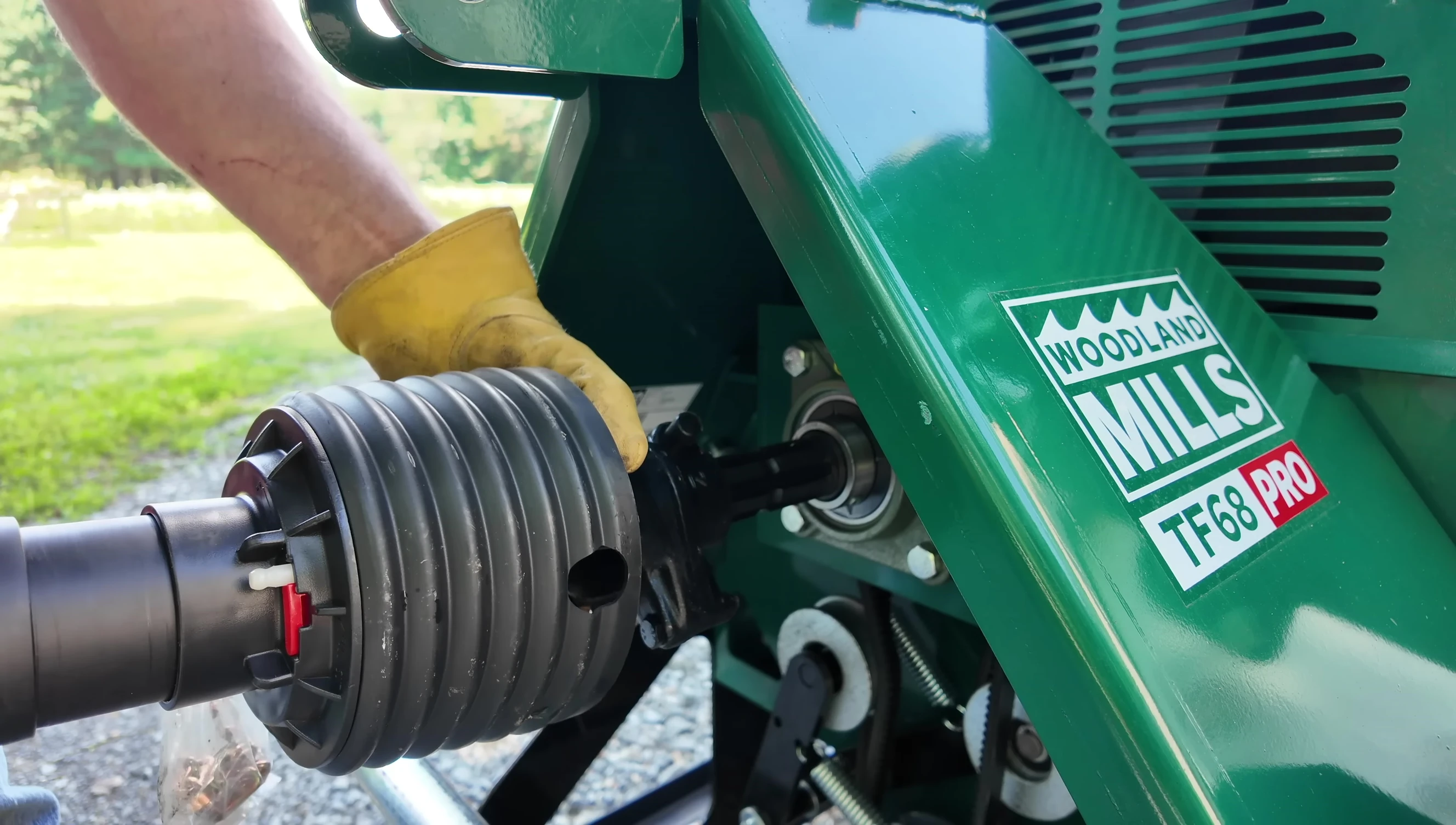 The push-button release mechanism on the PTO shaft.
