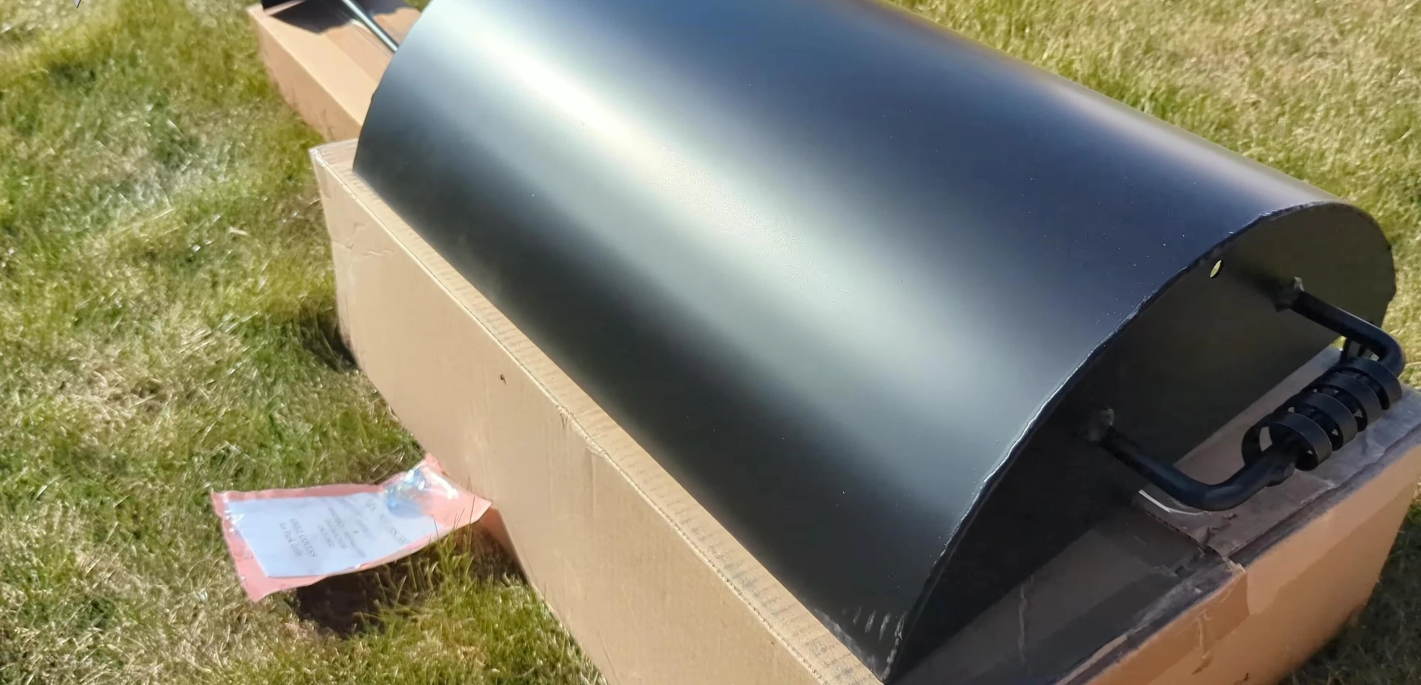 The grill scraper being used
