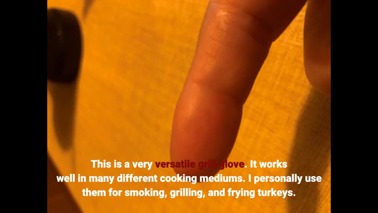 Close-up of the gloves being used for grilling.