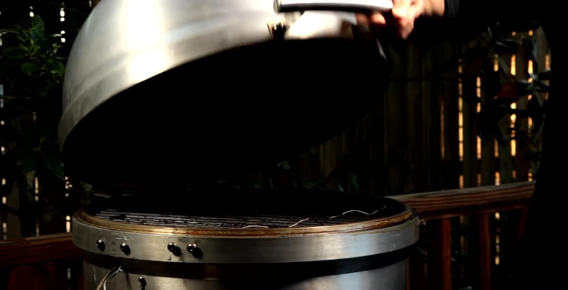 Placing the brisket on the grill, fat-side up.